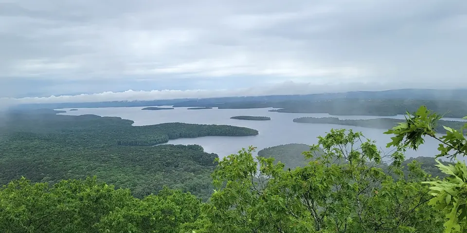A view over Lake Maumelle and forested hills from the Pinnacle Mountain summit