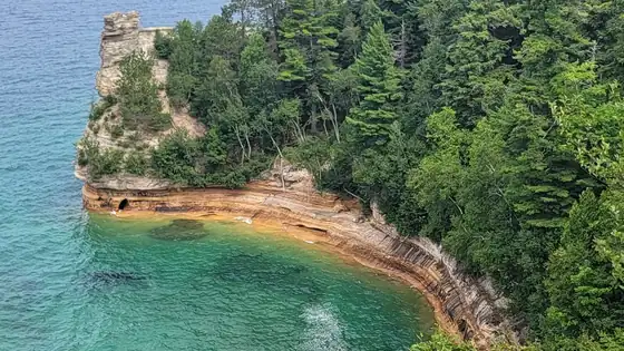 Miners Castle's sandstone turret above the turquoise water of Lake Superior