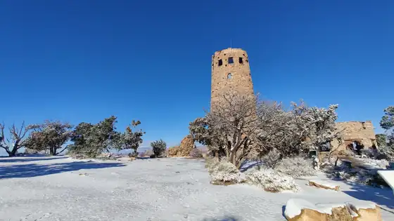 The Desert View Watchtower and a snow-dusted rim at Grand Canyon National Park