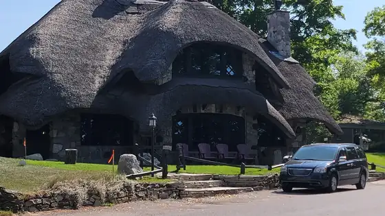 A stone mushroom house with a thatched-look roof in Charlevoix