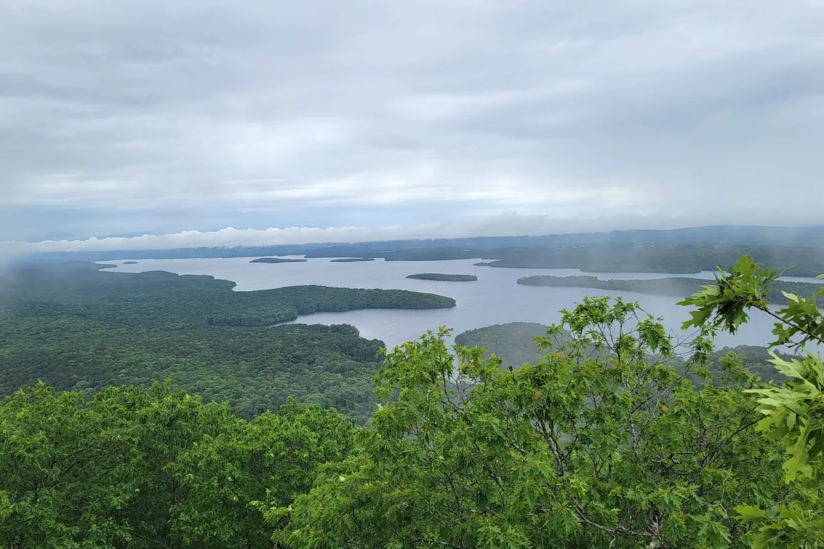 A view over Lake Maumelle and forested hills from the Pinnacle Mountain summit