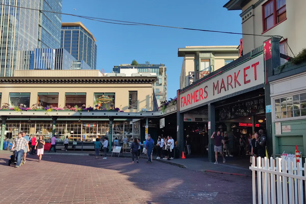 The Pike Place Farmers Market sign and the Post Alley sign in Seattle