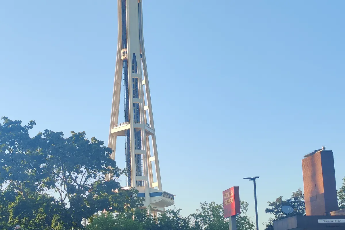 The Space Needle seen from the street and from directly beneath its saucer