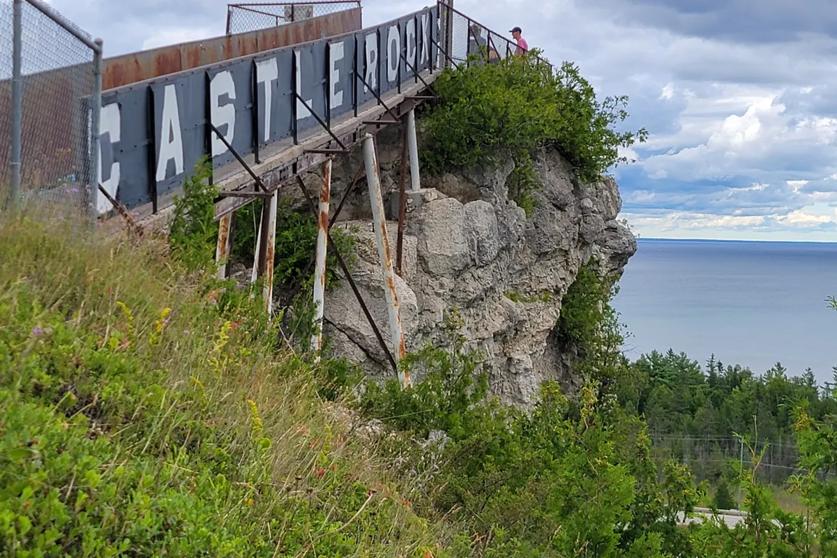 The Castle Rock sign on the rock tower above the Straits of Mackinac