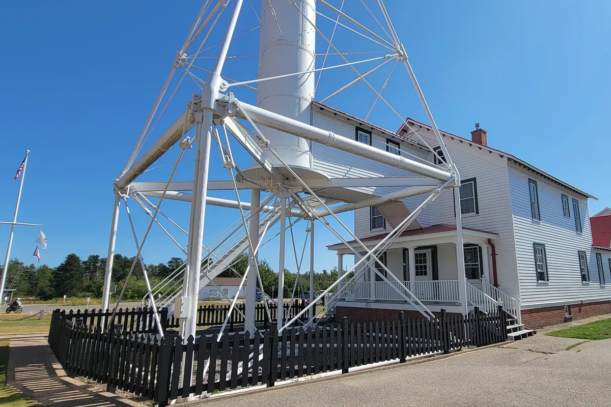The steel skeleton tower and white keeper's house at Whitefish Point Light Station