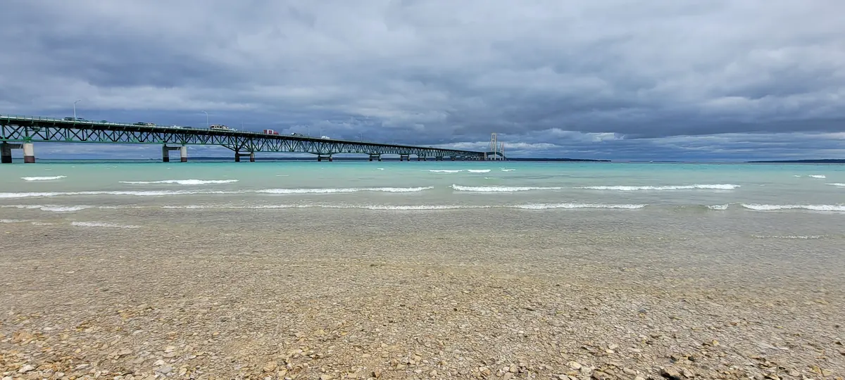 The Mackinac Bridge seen from the shore of the Straits of Mackinac
