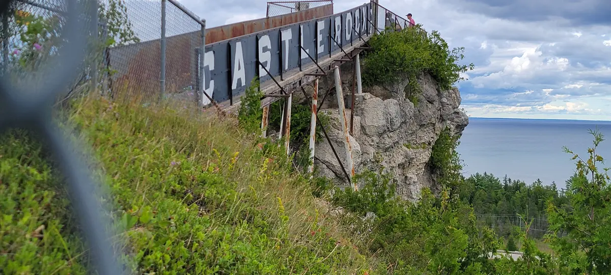 Castle Rock with its lookout platform and sign above St. Ignace