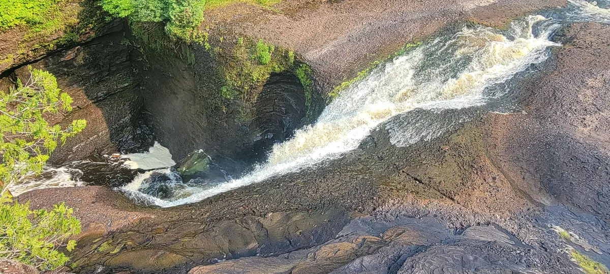 Sable Falls pouring over rock ledges, seen from above